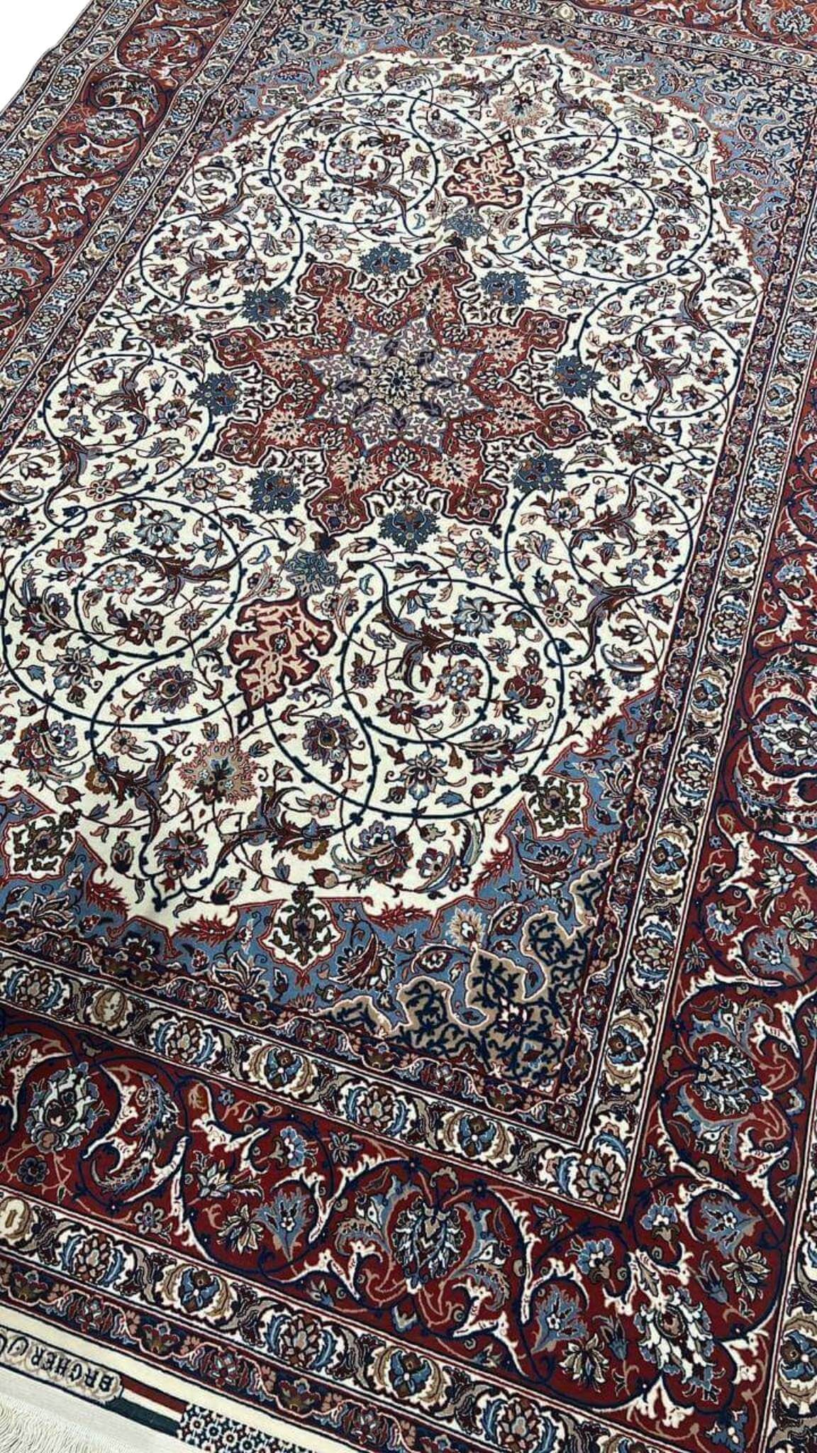 "Luxurious Persian rug featuring a star medallion and detailed floral patterns, hand-knotted in Isfahan, Iran."